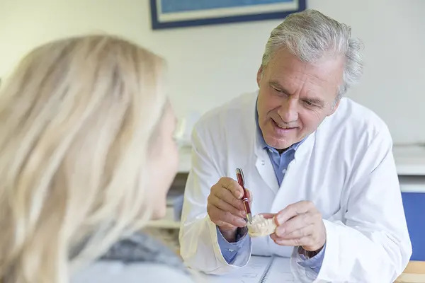 Patient and dentist discussing full arch treatment goals at Modesto Dentistry And Implants
