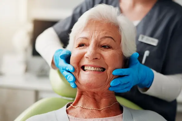 Patient enjoying her final full arch smile at Modesto Dentistry And Implants