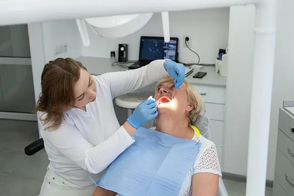 Patient smiling with a healing set of teeth at Modesto Dentistry And Implants